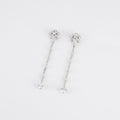 Boucles d'oreilles pendantes, or blanc et diamants