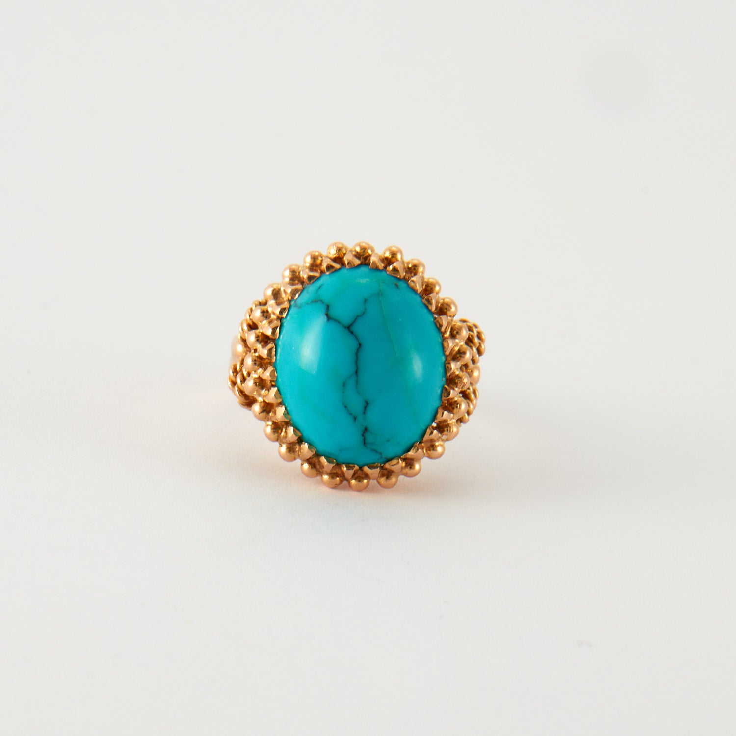 Bague cabochon turquoise en or rose.