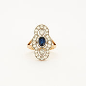 Bague style "Art Deco" en or jaune, platine, diamants et centre saphir.