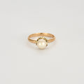 Solitaire en or rose et perle de 6,3mm.