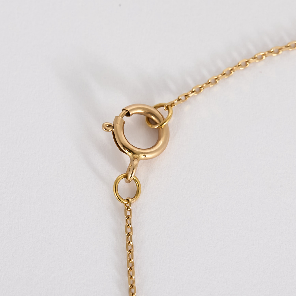Collier mini poire en or rose et diamants.