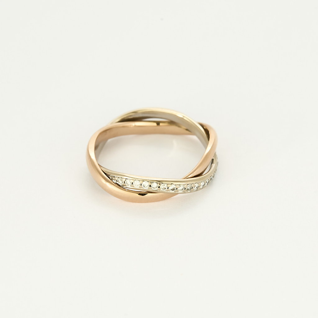Bague Poiray "Tresse" en or rose & or blanc pavée.