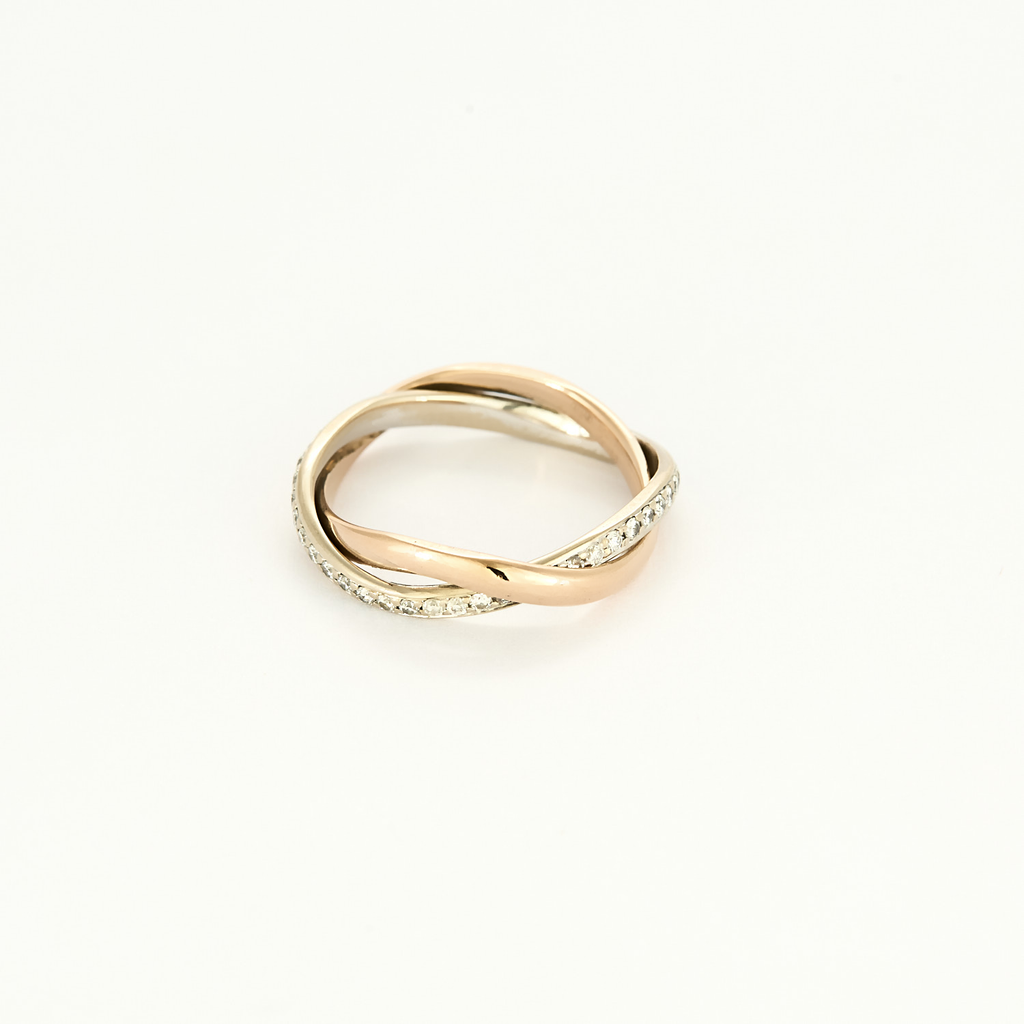Bague Poiray "Tresse" en or rose & or blanc pavée.