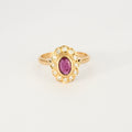 Bague marguerite en or jaune, diamants et centre rubis.