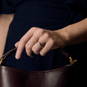 Bague Poiray "Tresse" en or rose & or blanc pavée.