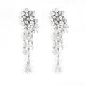 Boucles d'oreilles pendantes en or blanc pavées de diamants
