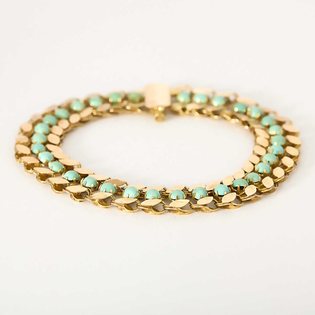 Bracelet ancien en or rose et turquoise.