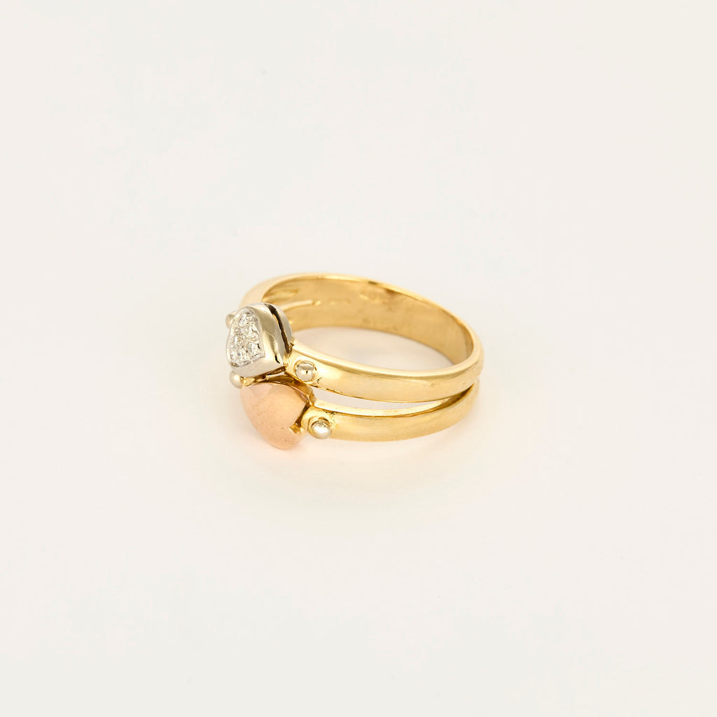Bague double anneau motifs cœurs en or et diamants
