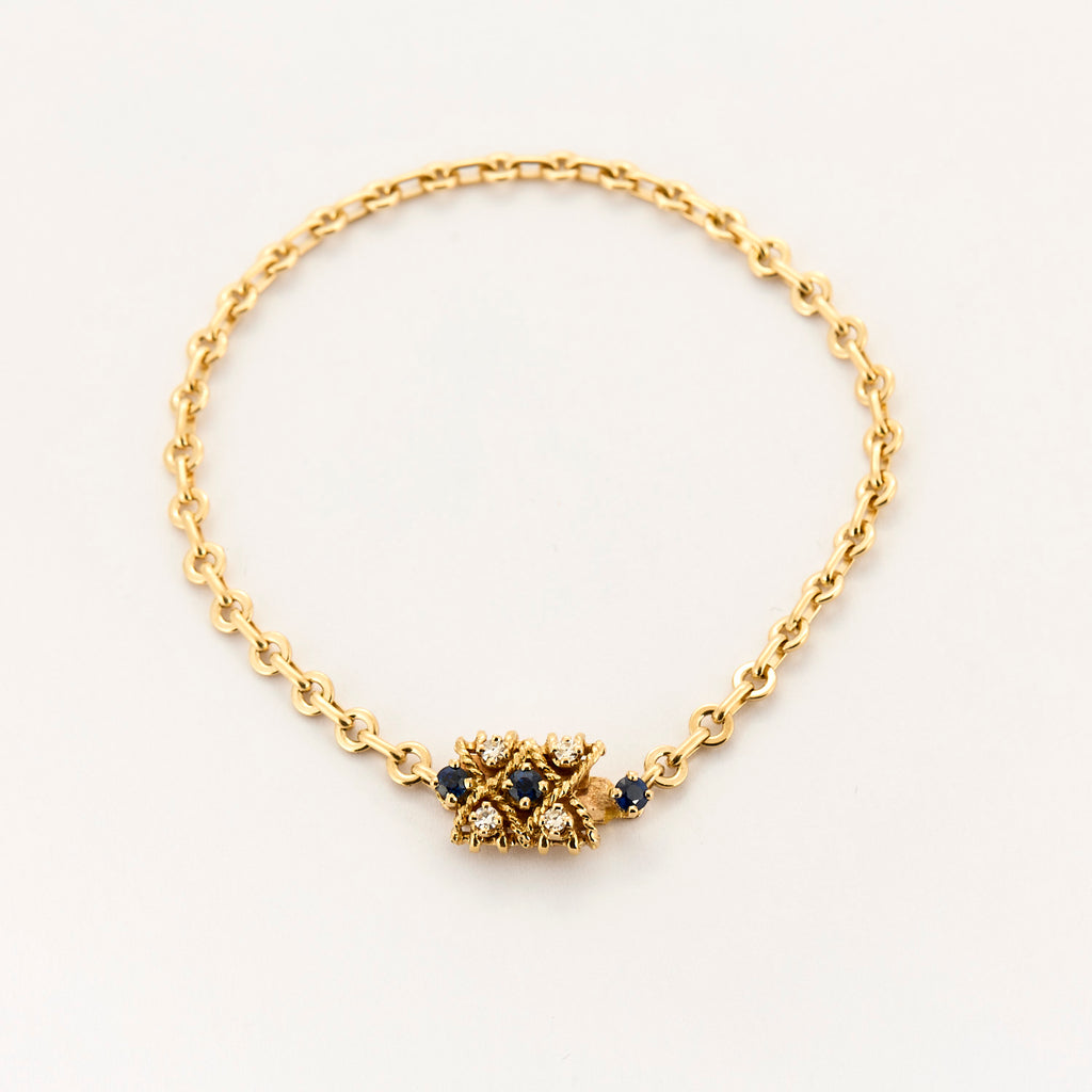Bracelet torsadé en or jaune saphir et diamants.
