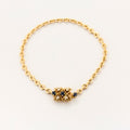 Bracelet torsadé en or jaune saphir et diamants.