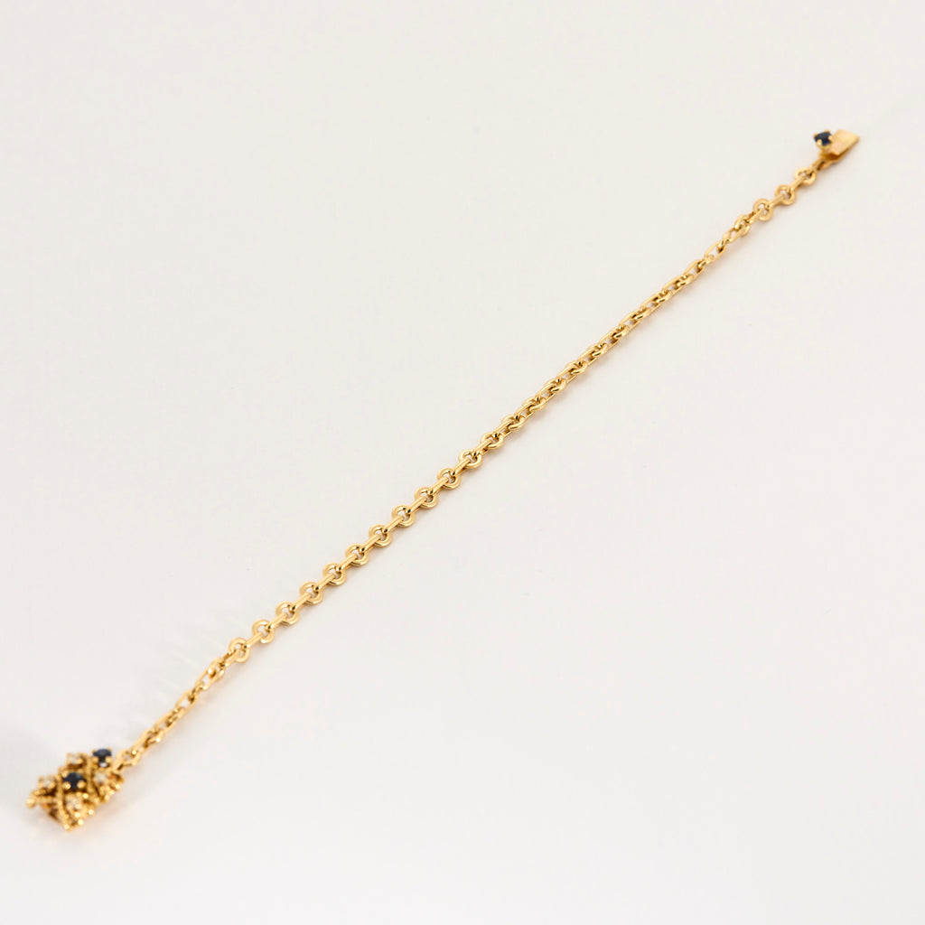Bracelet torsadé en or jaune saphir et diamants.