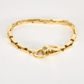 Bracelet CARTIER collection "Agrafe" en or jaune.
