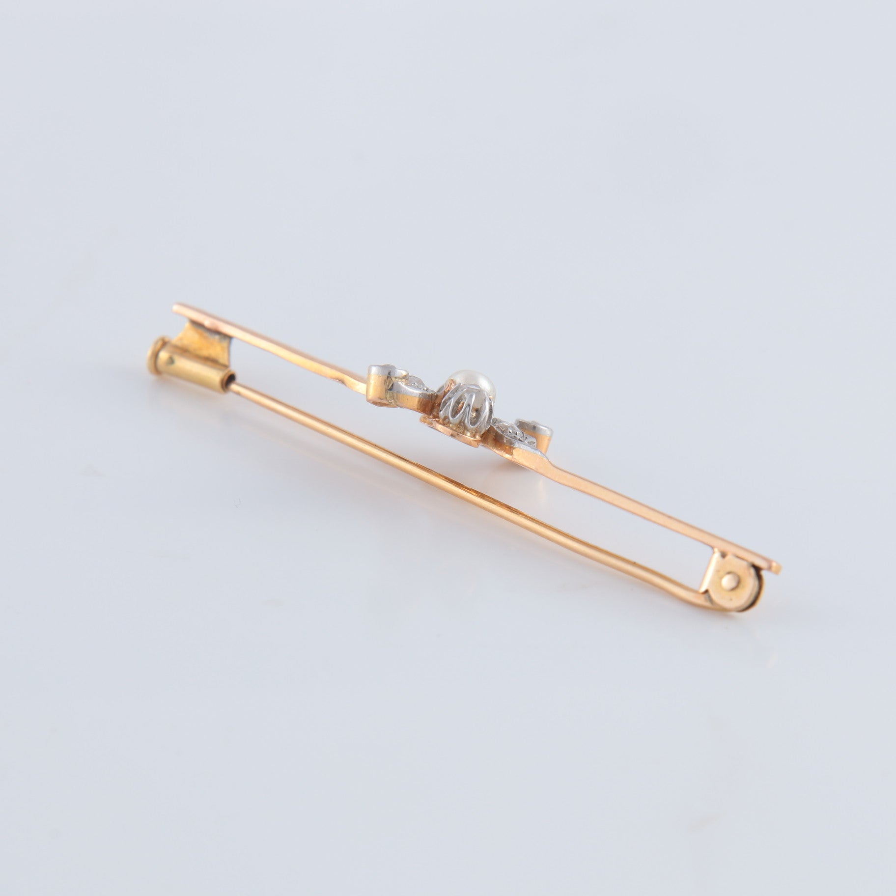 Broche or jaune, diamants et perle