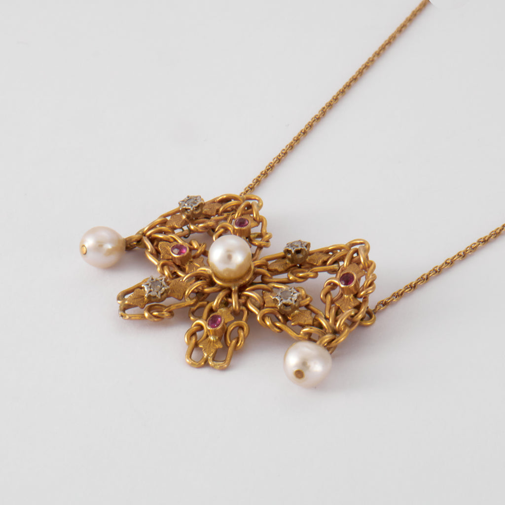 Collier Noeud en or perles, diamants et rubis