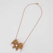 Collier Noeud en or perles, diamants et rubis
